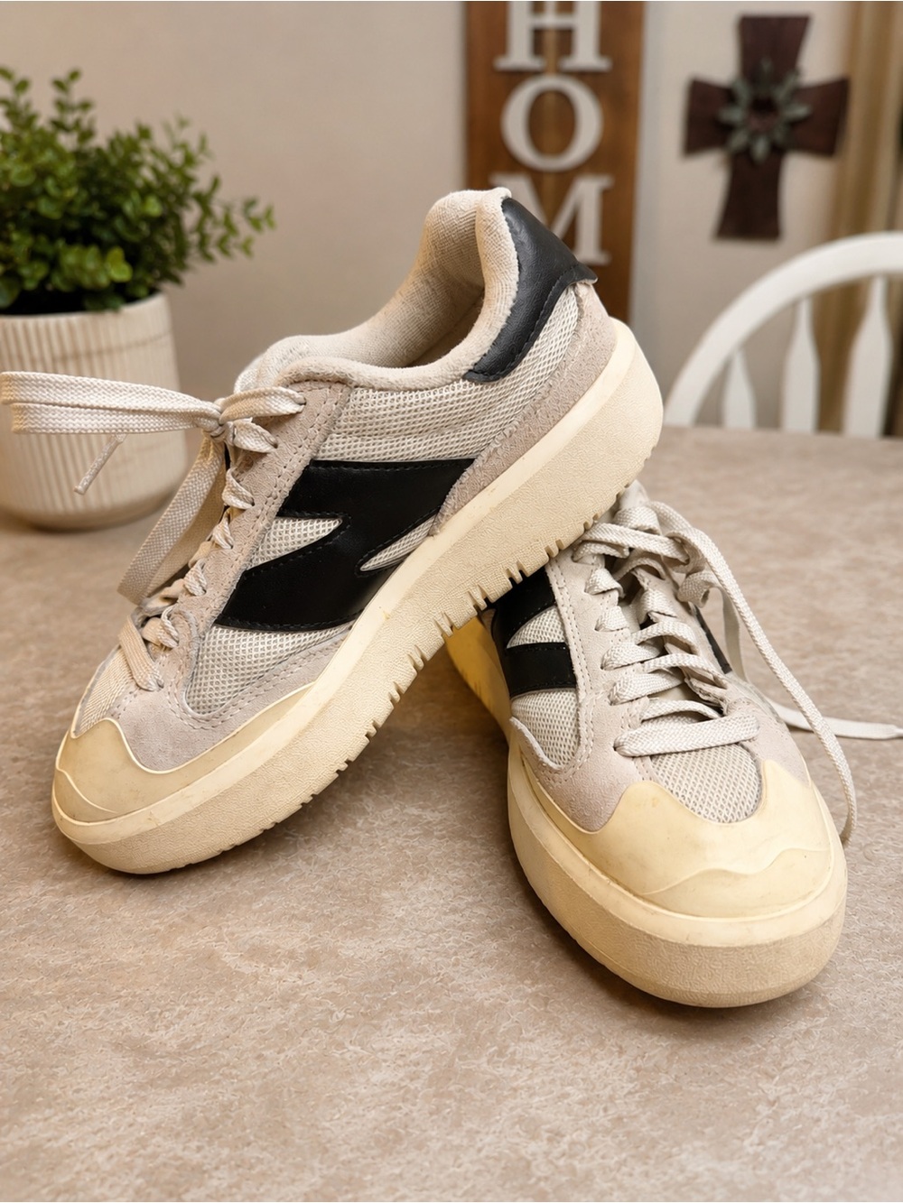 New Balance Beige and Black Retro-Style Sneakers